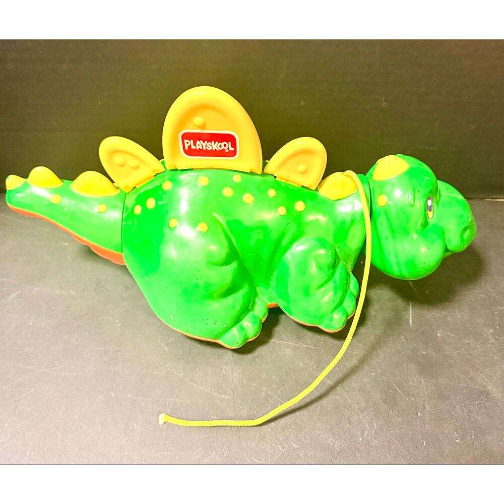 vintage 1993 Playskool Go Go Dinosaur pull-along green body and yellow accents